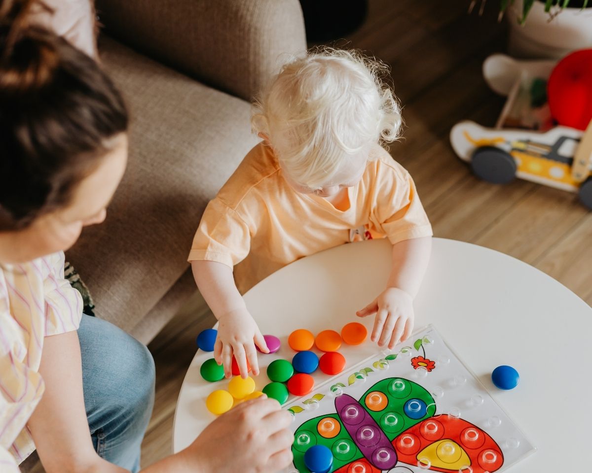Parent and toddler playing on the floor